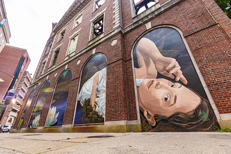 The Serpent (2024) by Amanda Hill. Hidden Mycellium (2024) by Maia Hay.Murals produced by The Avenue Concept in Providence, RI