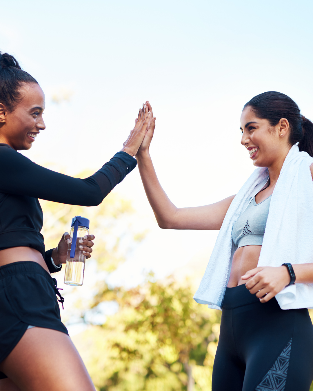 Two women celebrating a wellness win together
