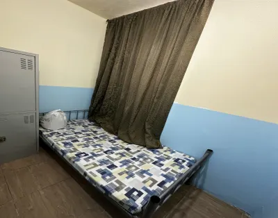 Comfortable partition room for rent in Al Salam Street