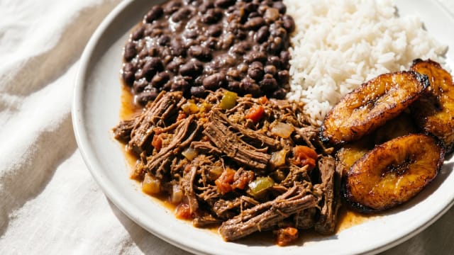 Pabellón Criollo (Shredded Beef, Black Beans, Rice, and Plantain)