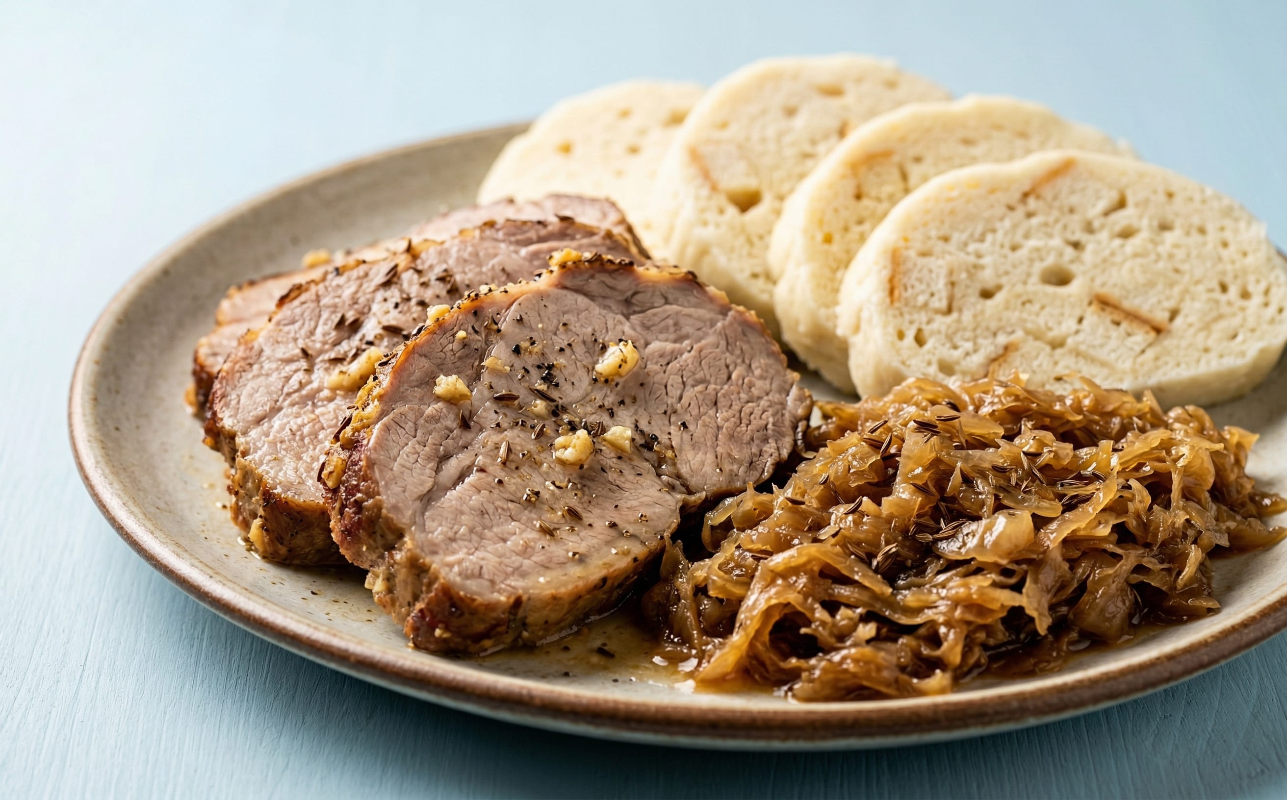 Vepřo Knedlo Zelo (Roast Pork, Bread Dumplings, and Sauerkraut)