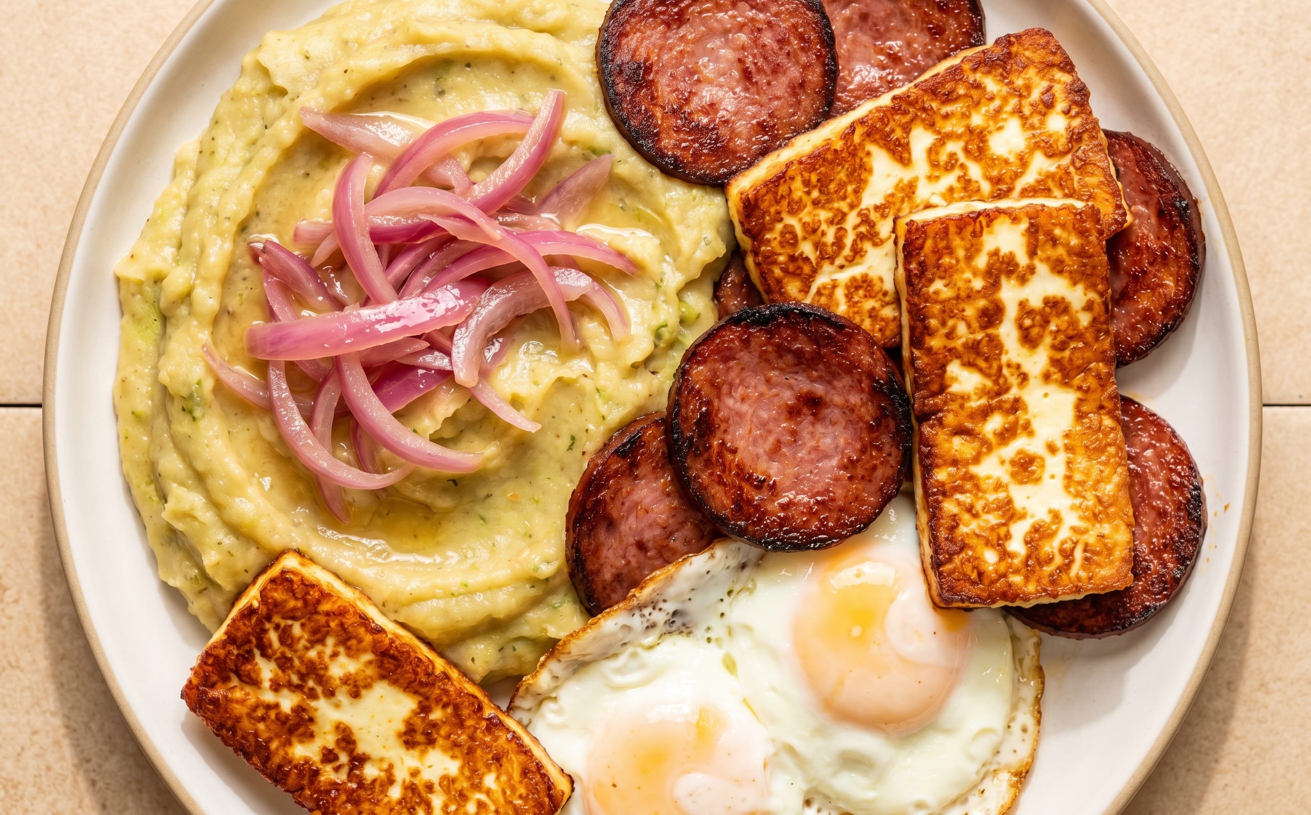 Mangú con Los Tres Golpes (Mashed Plantains with Breakfast Sides)