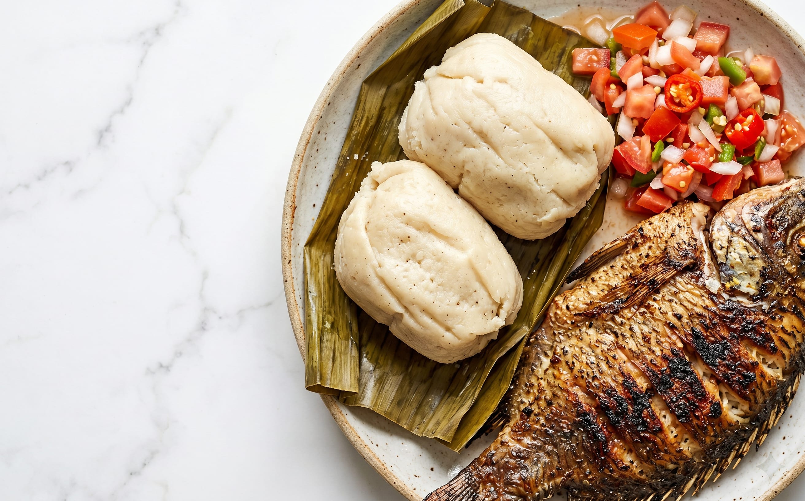Kenkey with Grilled Fish and Pepper Sauce