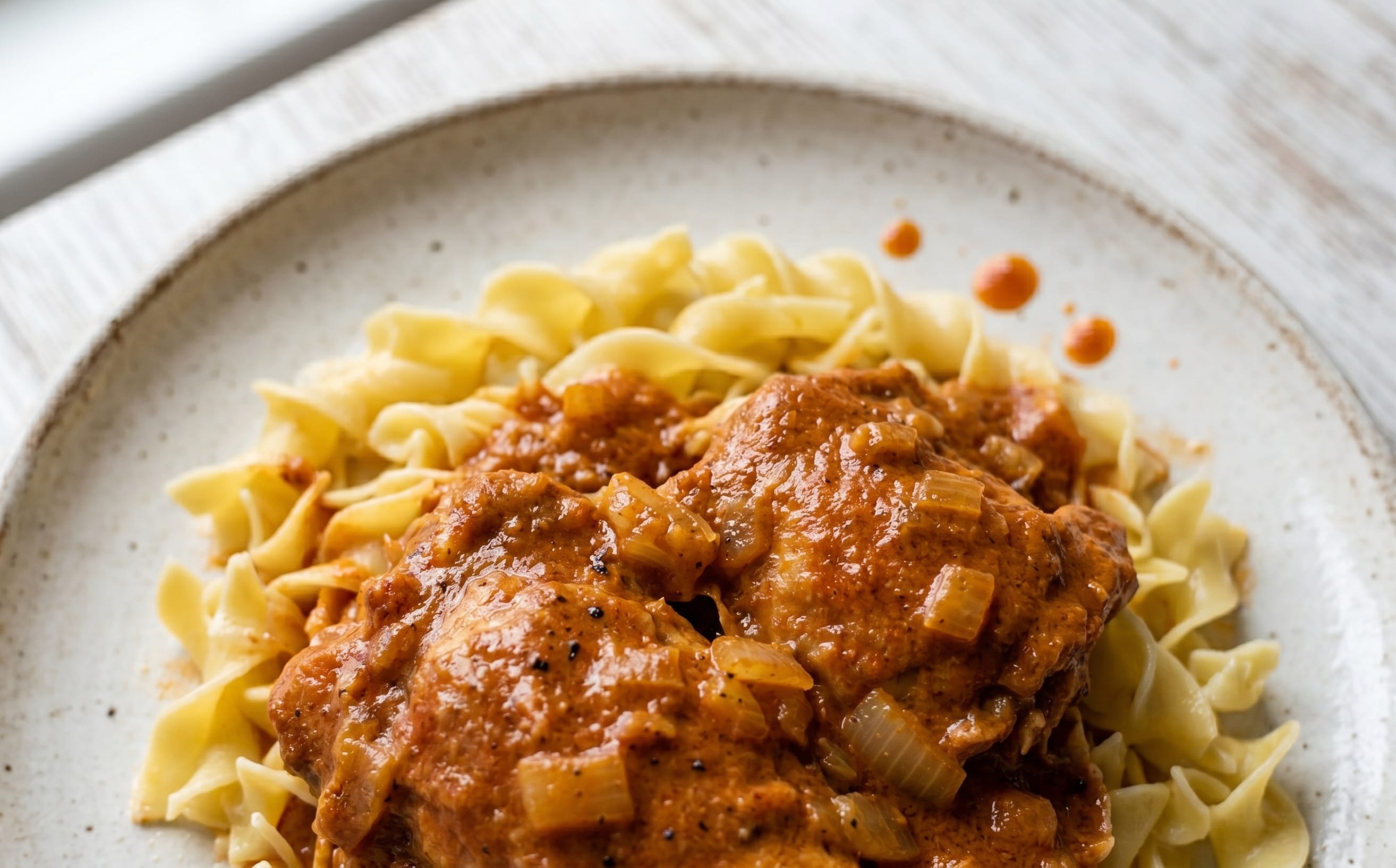 Csirkepaprikás (Chicken Paprikash with Buttered Noodles)