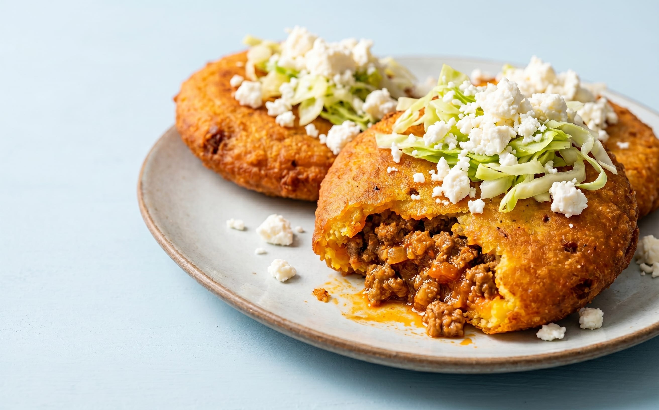 Enchiladas Nicaragüenses (Stuffed Fried Corn Patties)