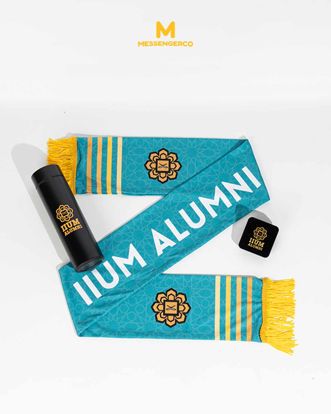 A tumbler and mafla with the IIUM Alumni logo featuring a custom box design, ideal for promotional or souvenir use.