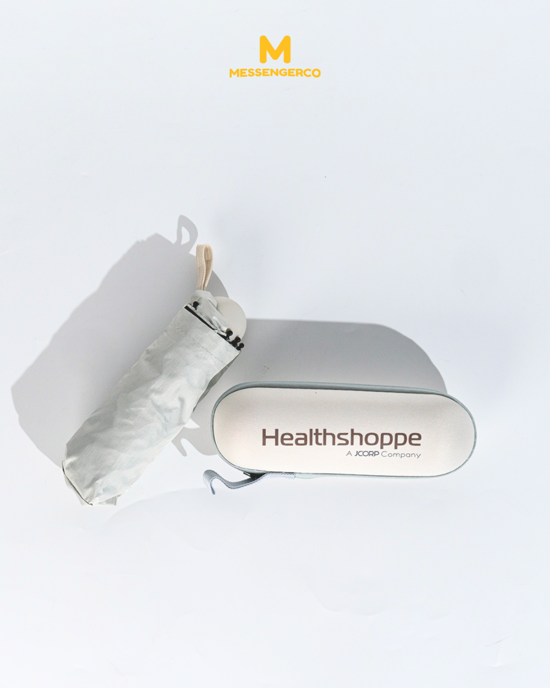 A branded umbrella with KPJ HealthShoppe logo, featuring the brand's distinct design for promotional or corporate use.