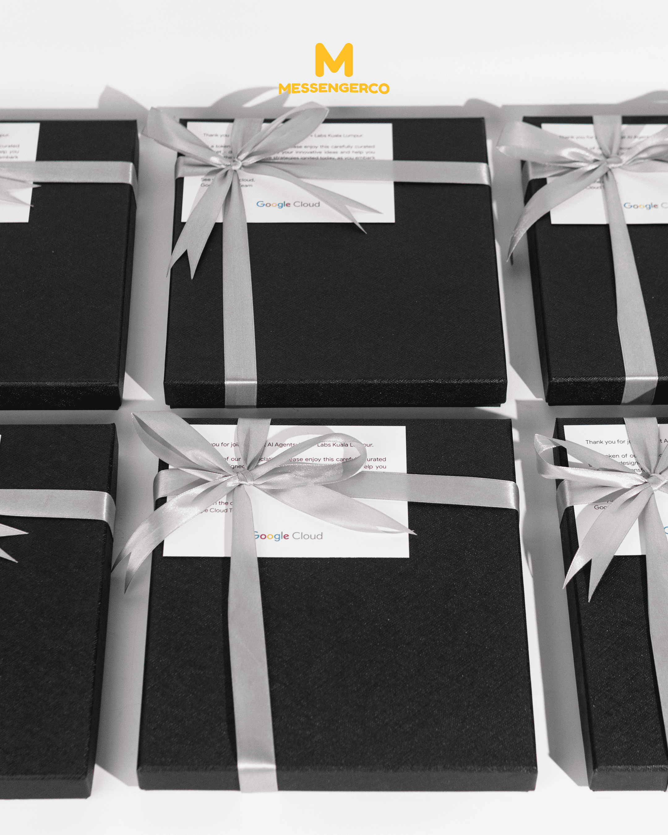 A variety of corporate gift seminar giveaways laid out, including tech-themed items, ideal for promotional events on a Google Cloud marketing showcase.