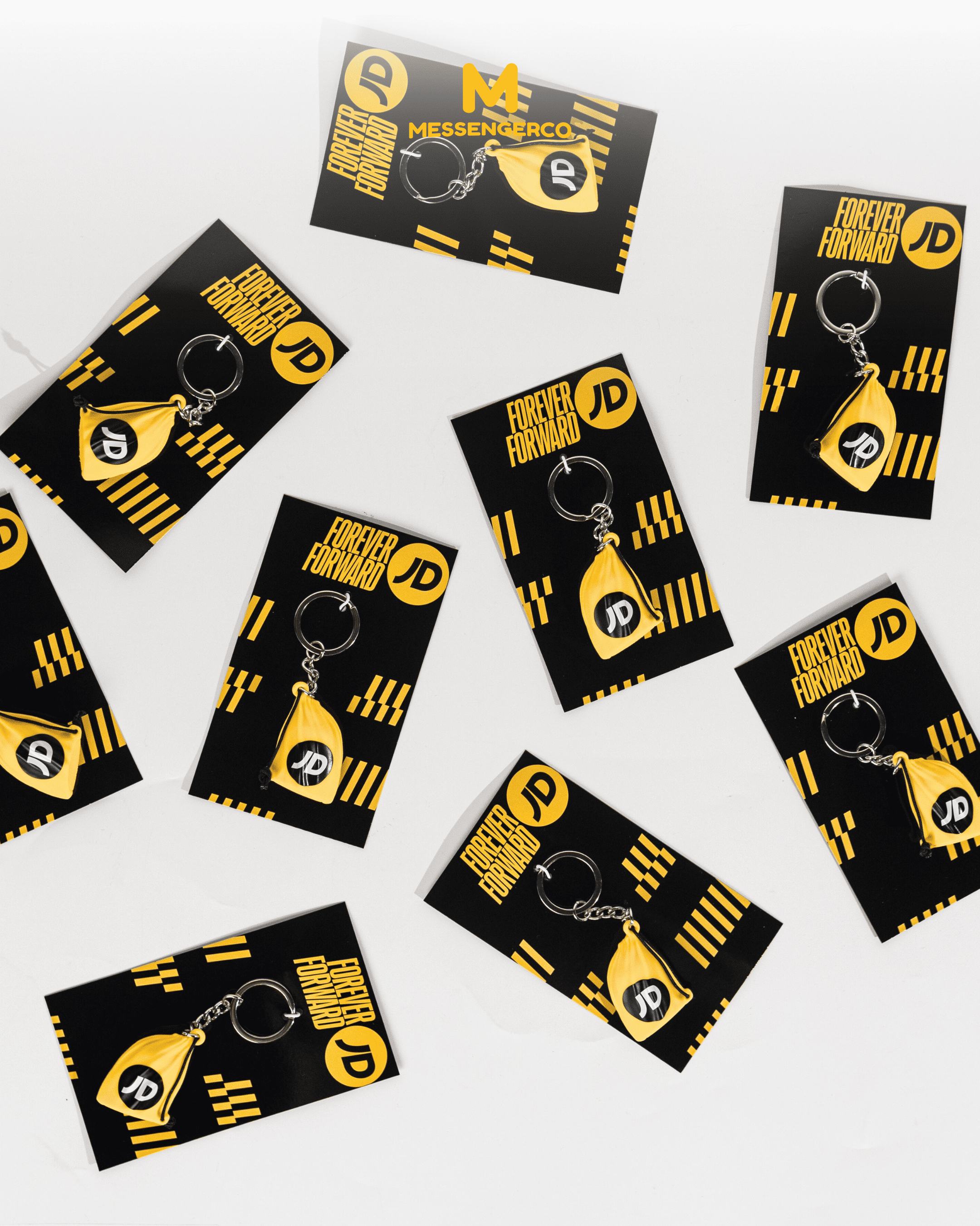 Custom-designed keychain with JD Sport branding and sustainable packaging, ideal for personalized merchandise displays.