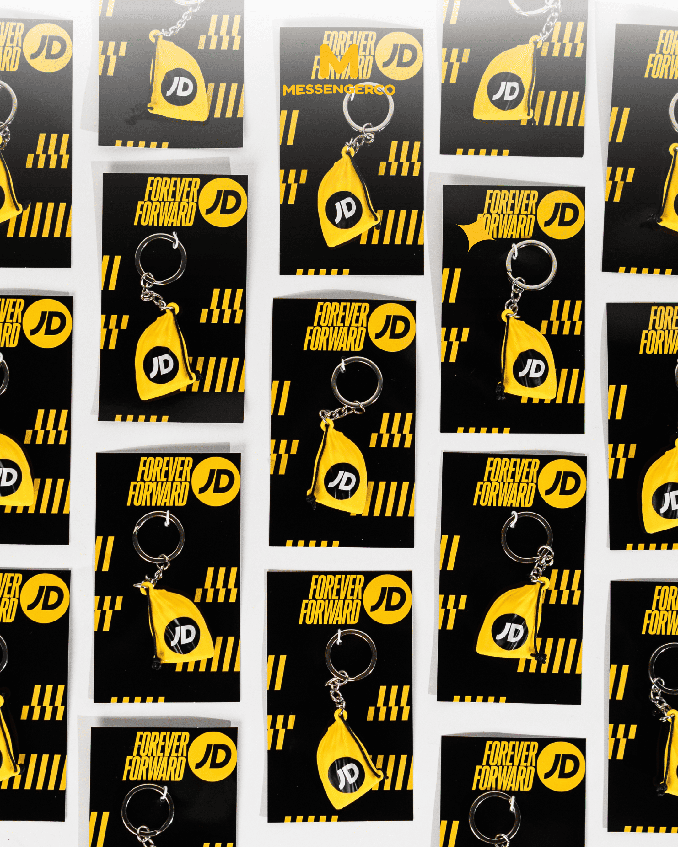 Custom designed keychain and its packaging for JD Sport, featuring branding and sleek styling. Ideal for showcasing bespoke merchandise options.