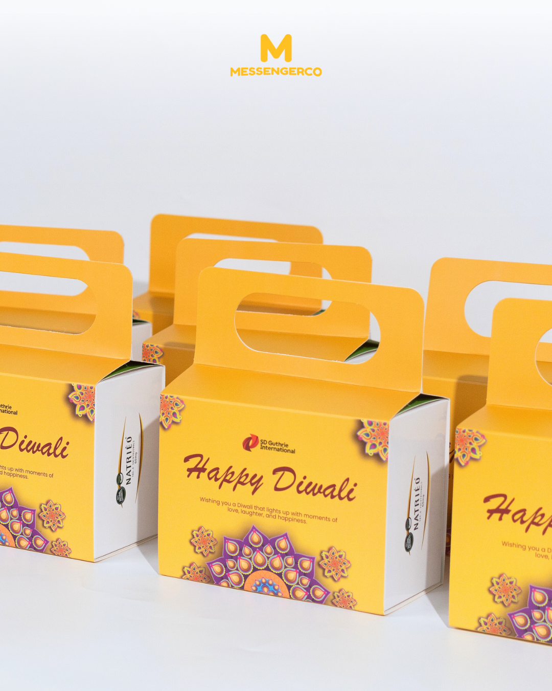 bright yellow deepavali gift boxes with festive pattern and handle customised for sd guthrie
