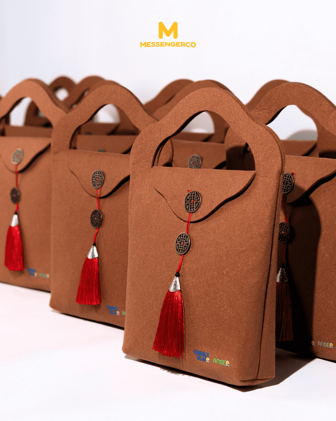 A felt tassel bag featuring decorative accents and a logo print, ideal for branding highlighting.