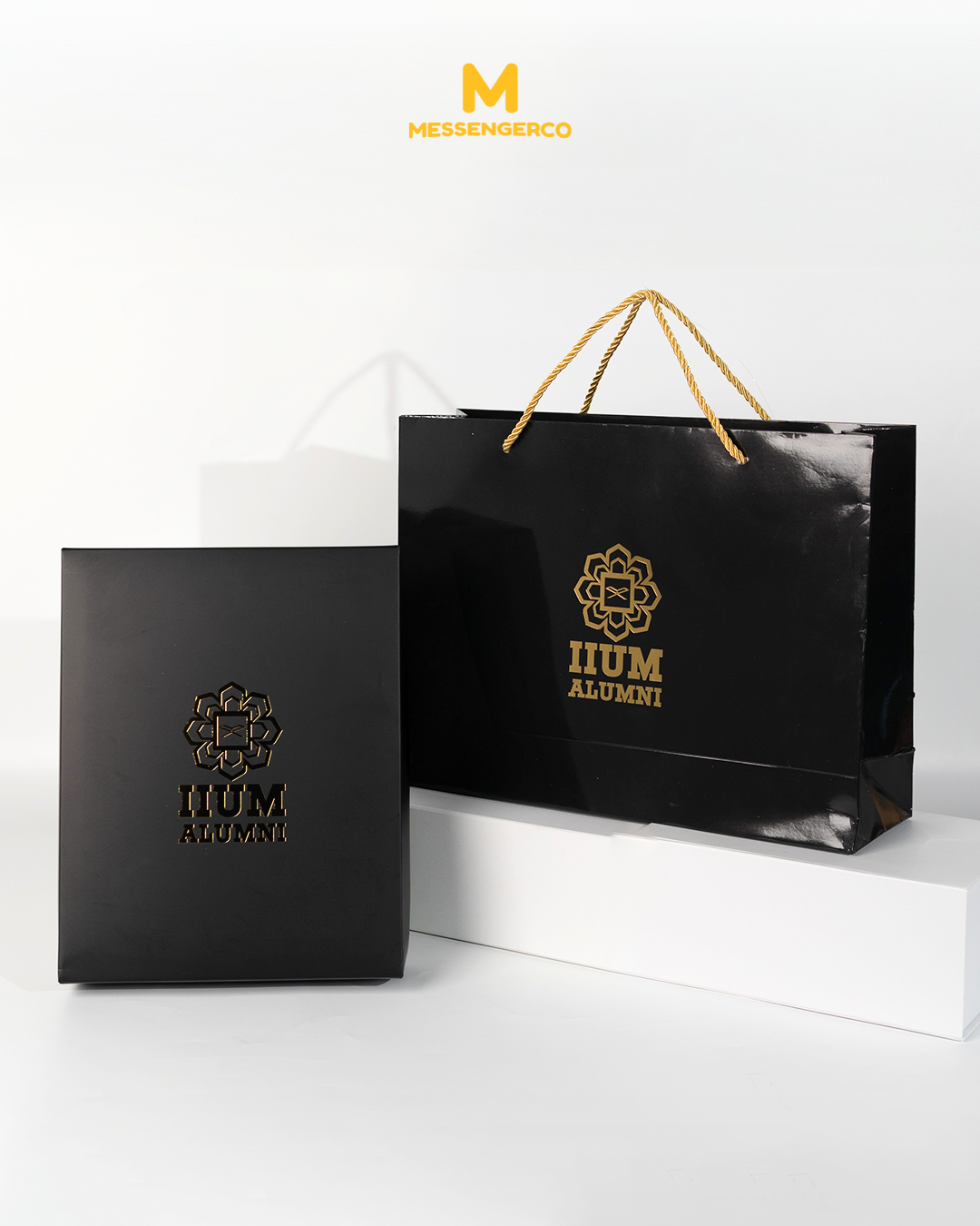 Premium custom laminated paper bag paired with a matte box, created for IIUM alumni promotion, featuring professional branding elements.