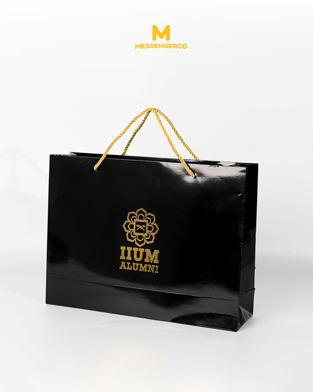 Premium custom laminated paper bag for IIUM alumni featuring school branding and logo, ideal for promotional use.