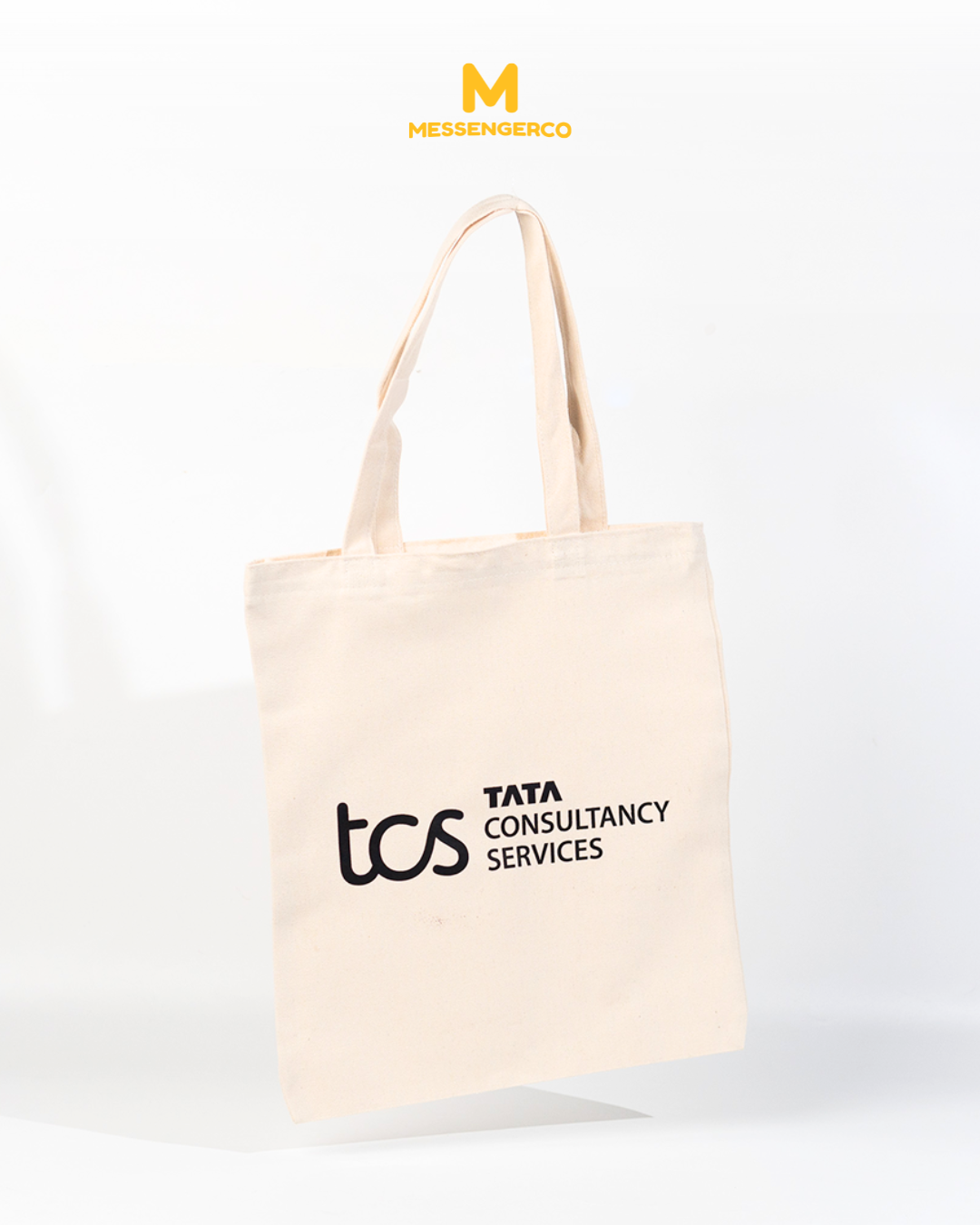 A tan tote bag printed with the TCS Malaysia logo, ideal for corporate branding and promotional use.