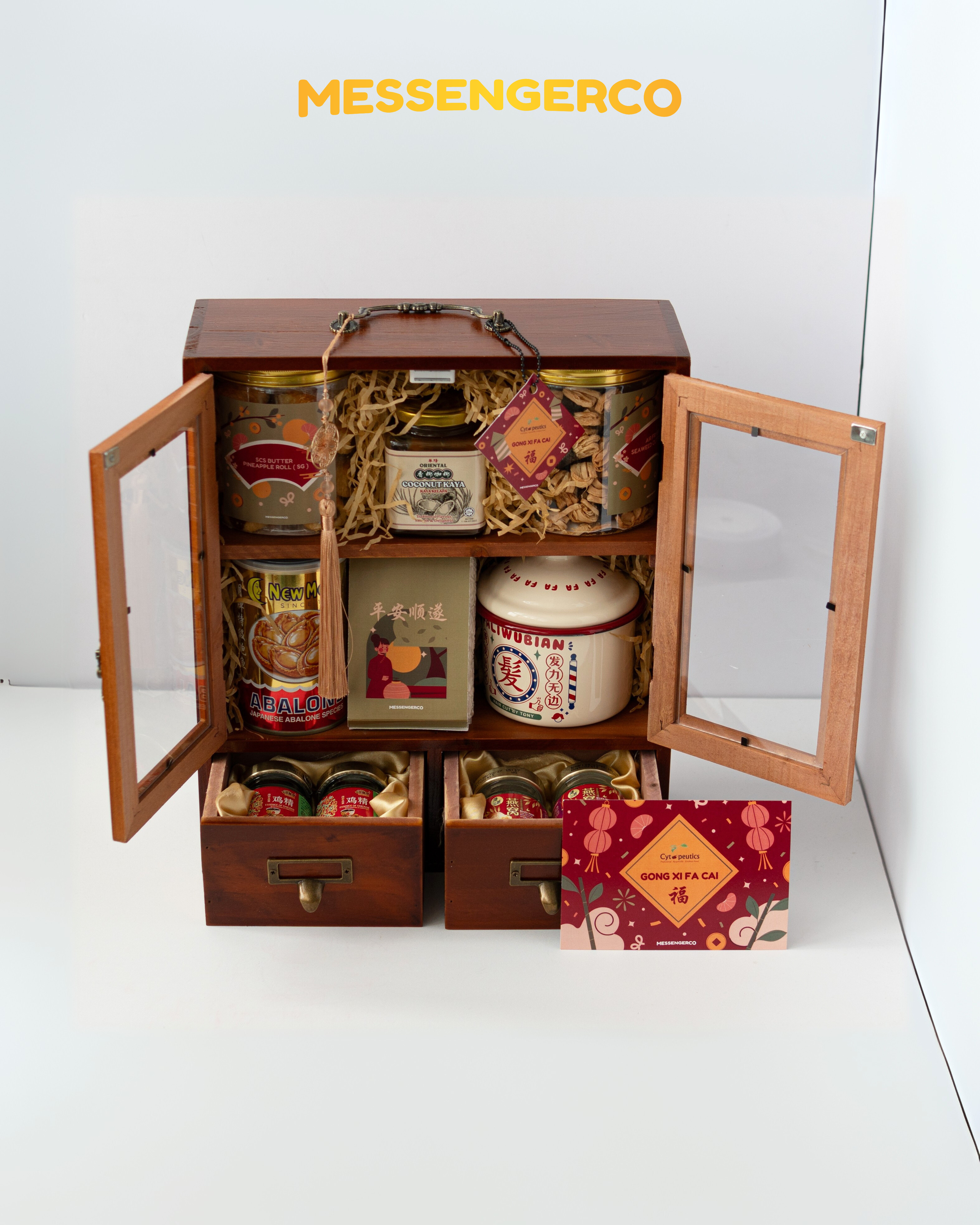 Open Rising Gold Chinese New Year hamper by MessengerCo with abalone, bird’s nest, snacks and vintage enamel mug in wooden case for festive corporate gifting.
