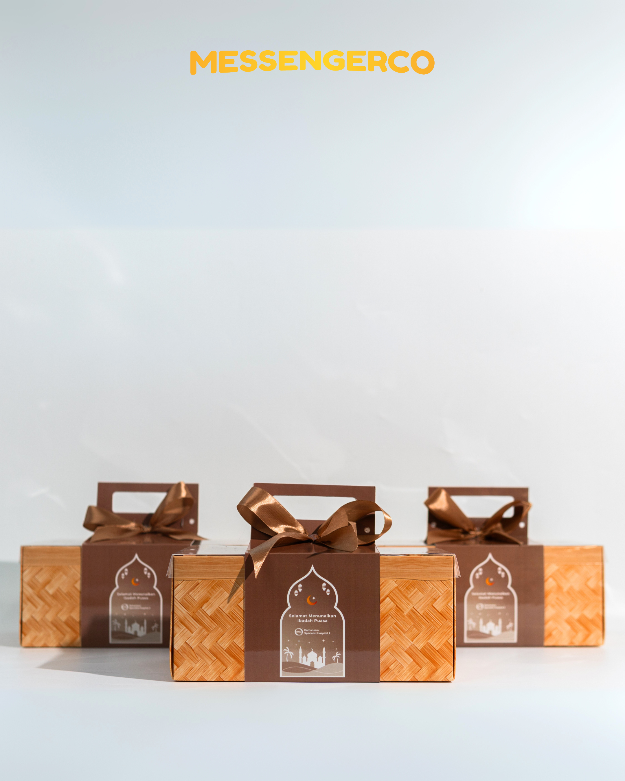 group of brown woven ramadan gift boxes tied with satin ribbons customised for damansara specialist hospital