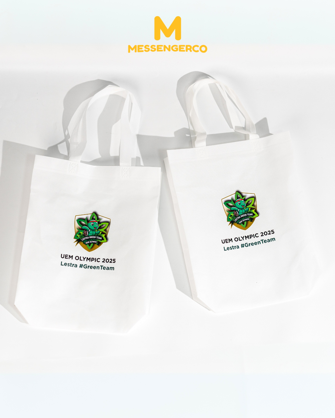 white non-woven tote bags printed with uem olympic 2025 logo for event food pack giveaways