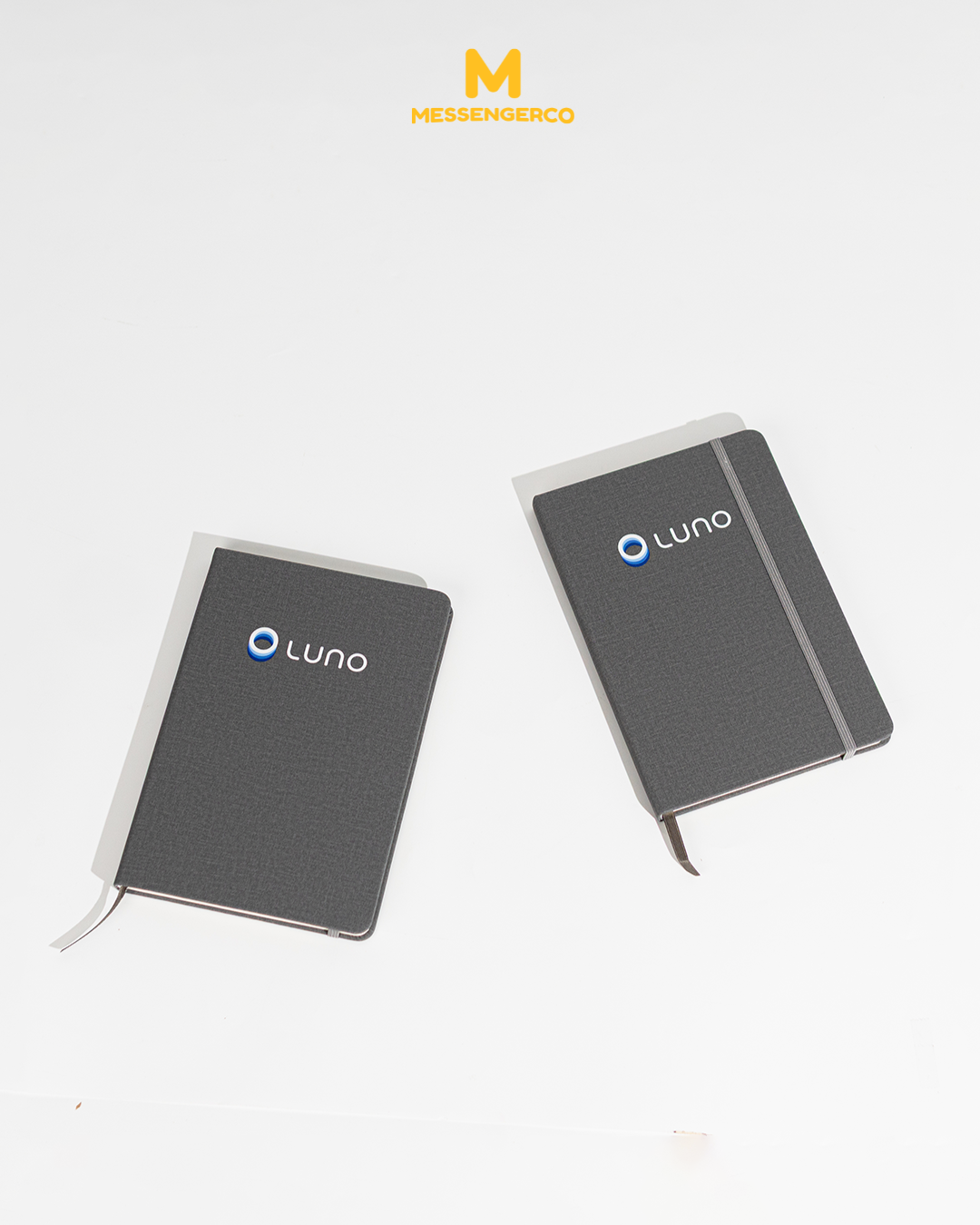two grey a5 notebooks with luno logo customised for company gifting
