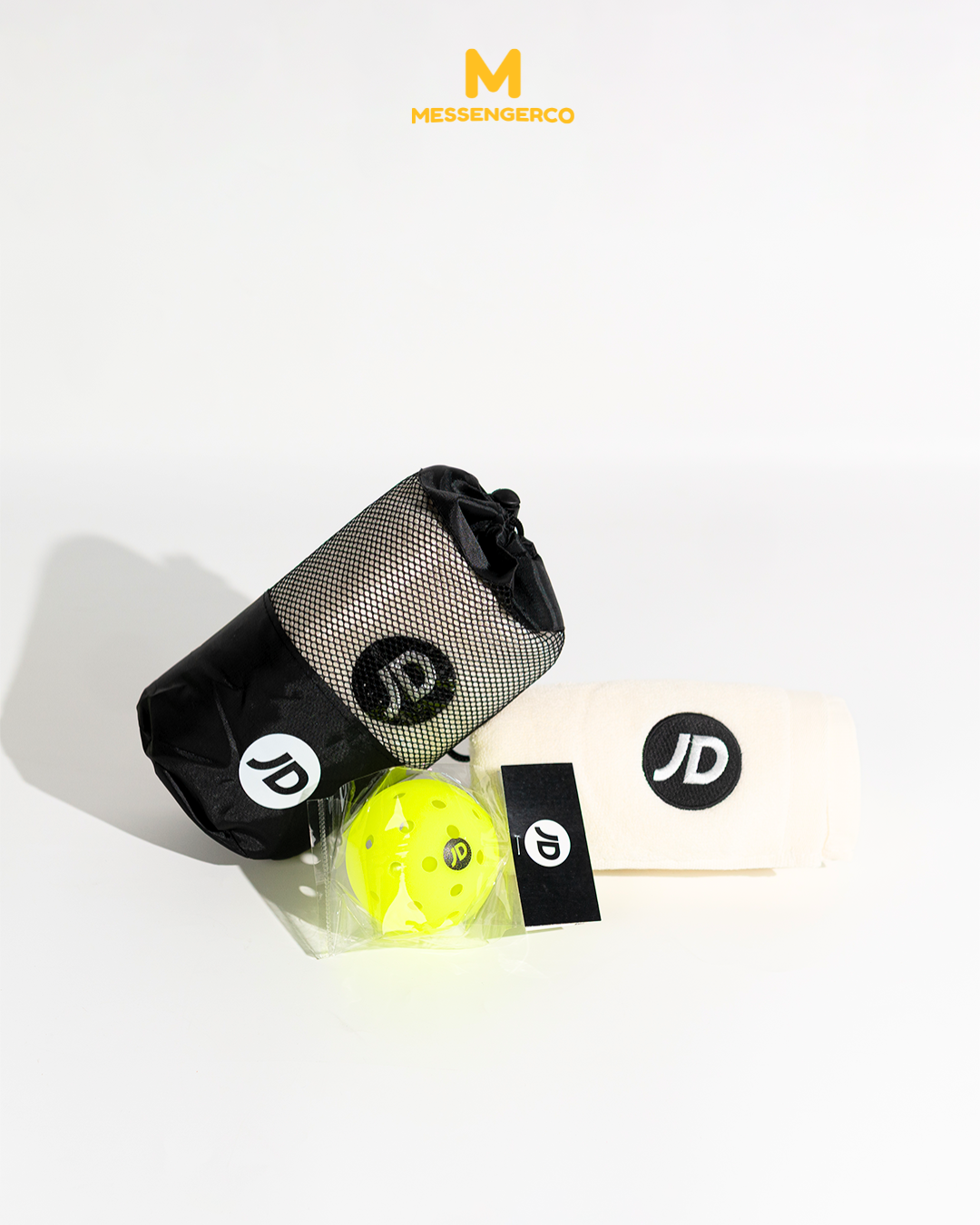 pickleball gear set for jd sports including branded towel, mesh pouch, and pickleball equipment