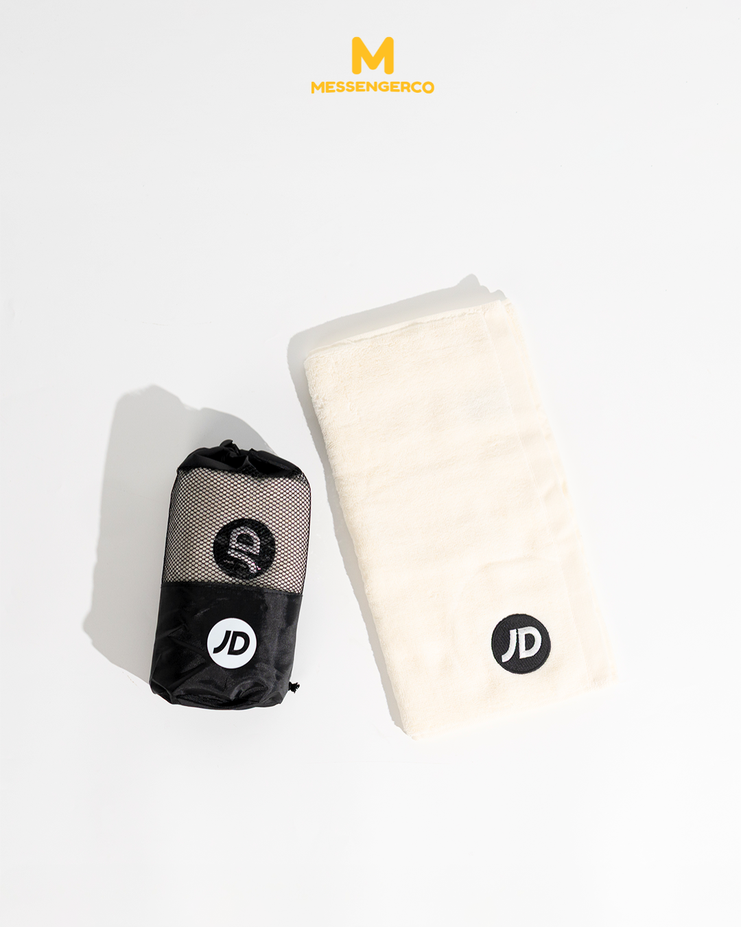 white towel and black mesh pouch with jd logo from jd sports pickleball merchandise