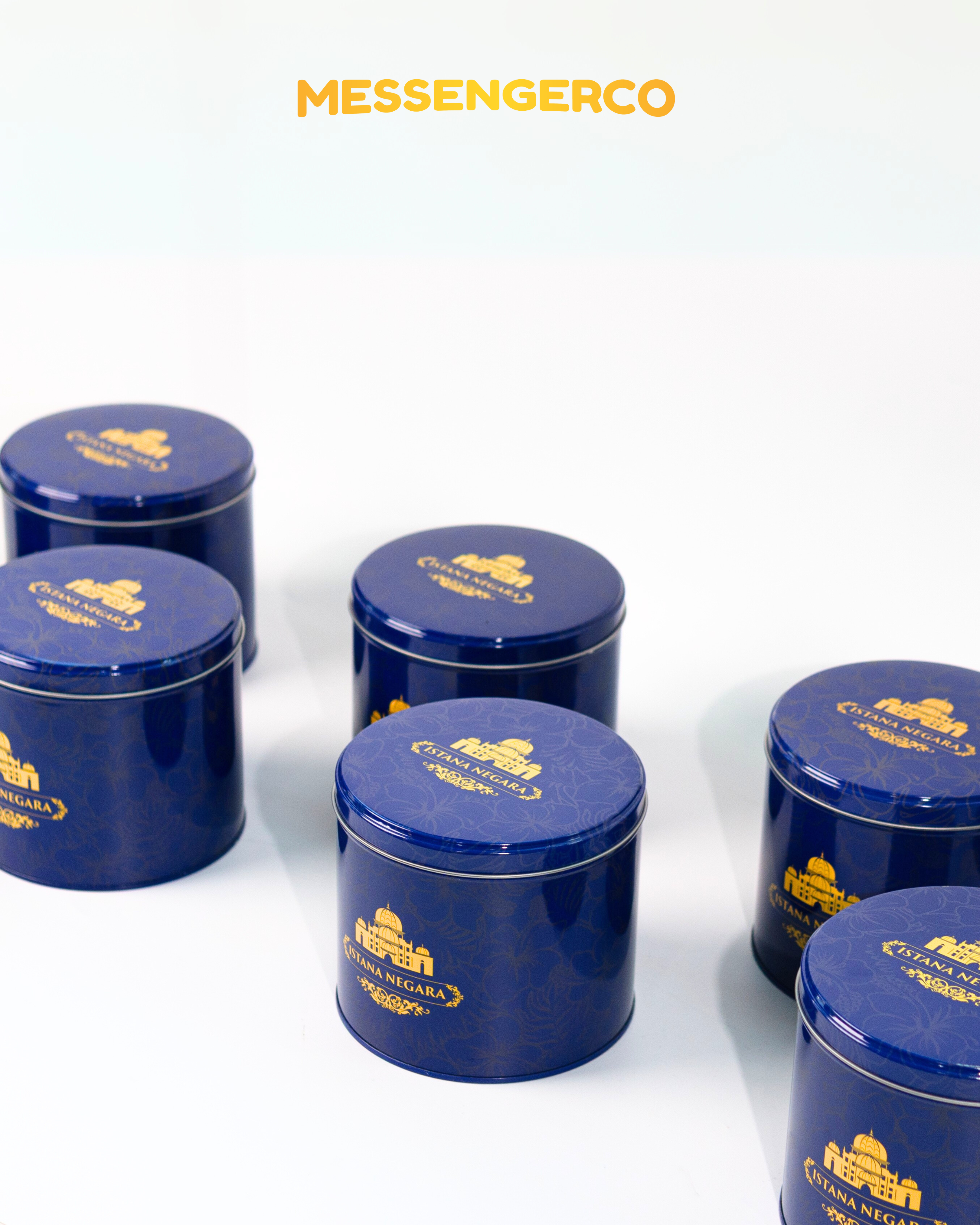 elegant arrangement of royal blue cookie tins customised for istana negara corporate gifting