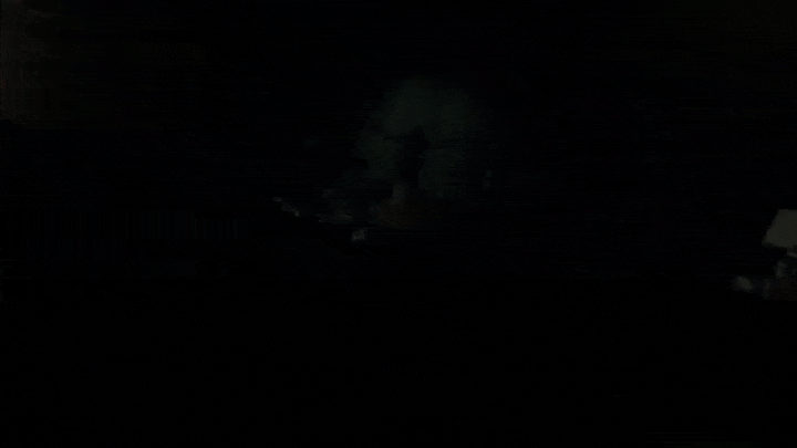 A gif of the video game Alan Wake II showing a camera panning away from the character in a rotating spiral motion.