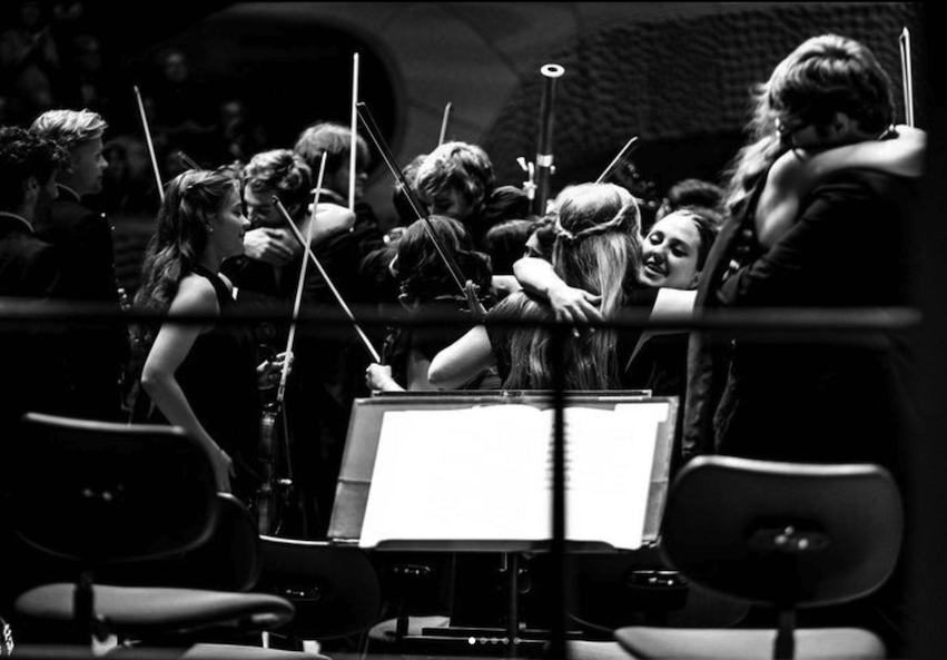 Youth orchestra on stage.