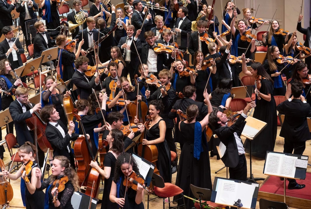 Youth orchestra on stage.