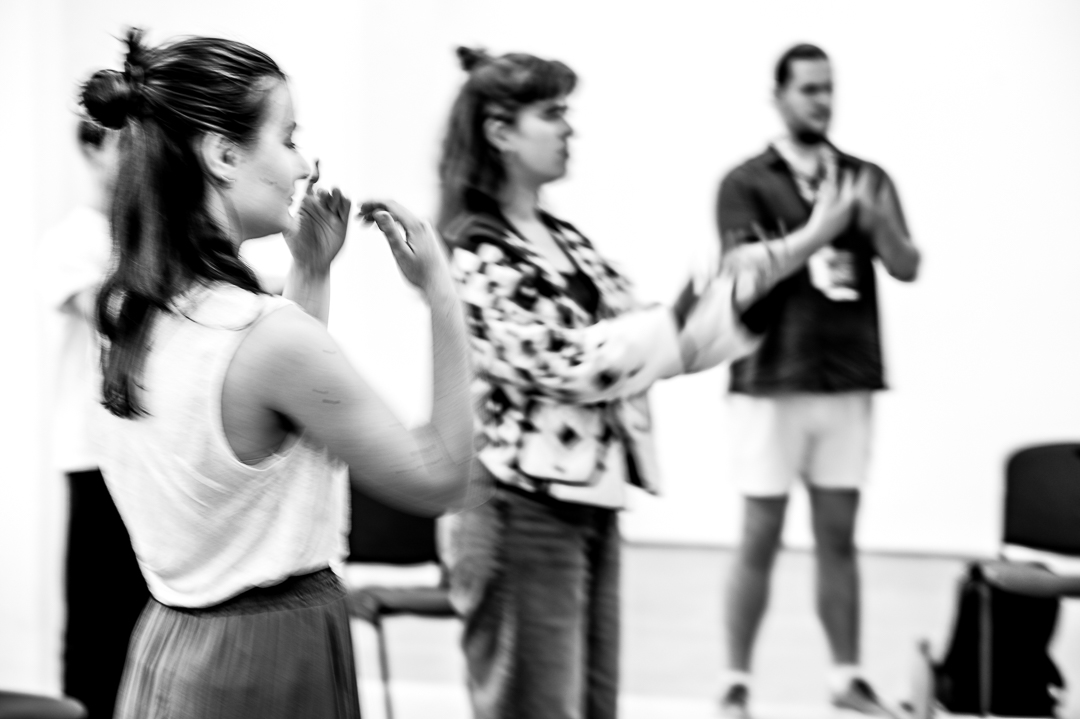 3 people participating in a wellbeing session