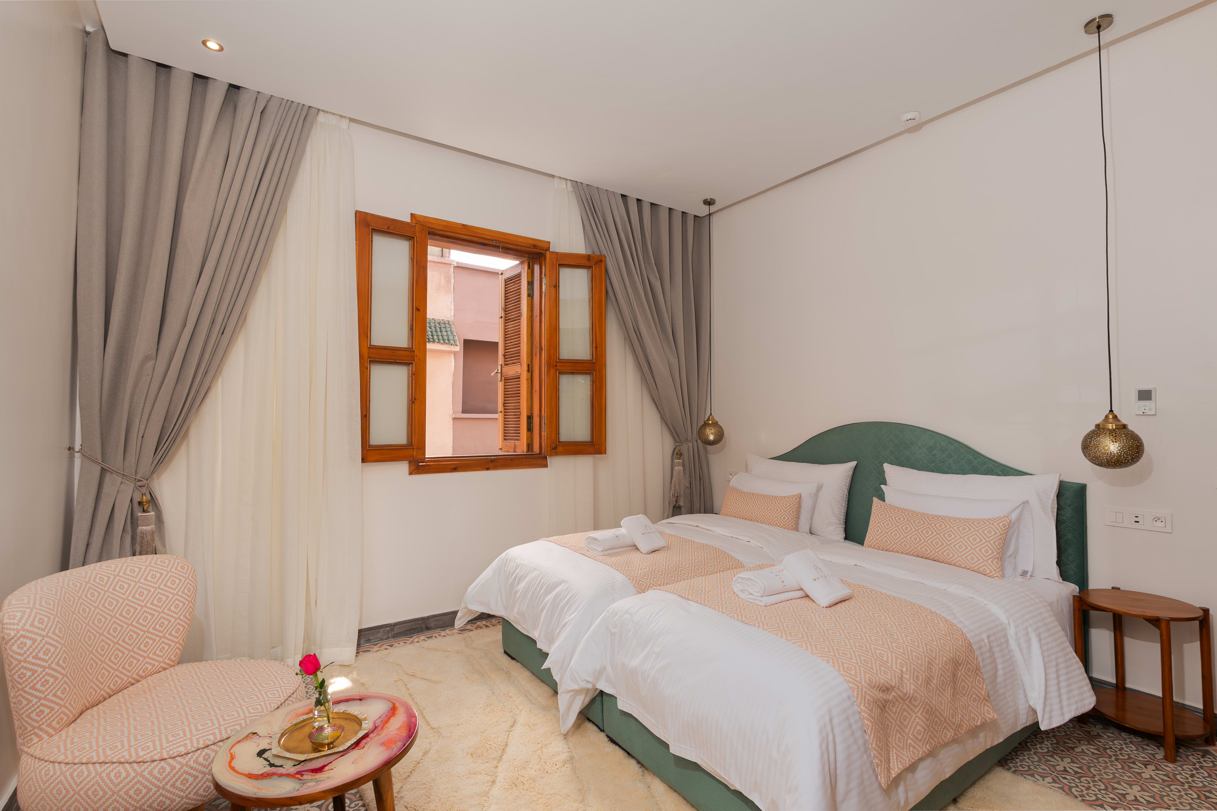 Tilila and Anzar - Deluxe Twin Room at Maison Ziri, Marrakech - two double beds in peach-green or burgundy palette