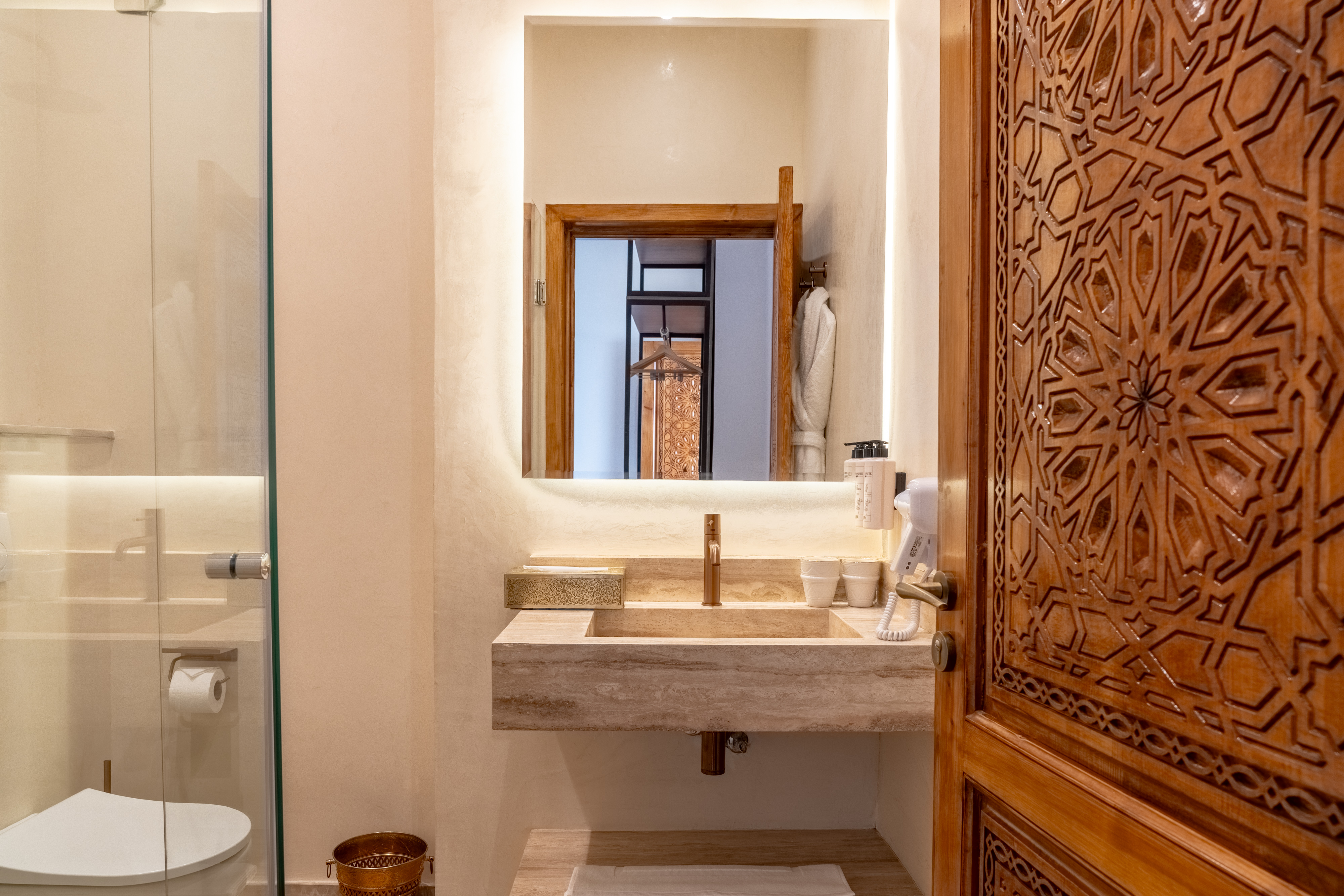 Deluxe Twin bathroom travertine