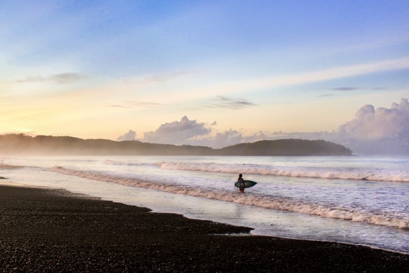 Waves rolling onto Playa Venao beach at sunset in Panama