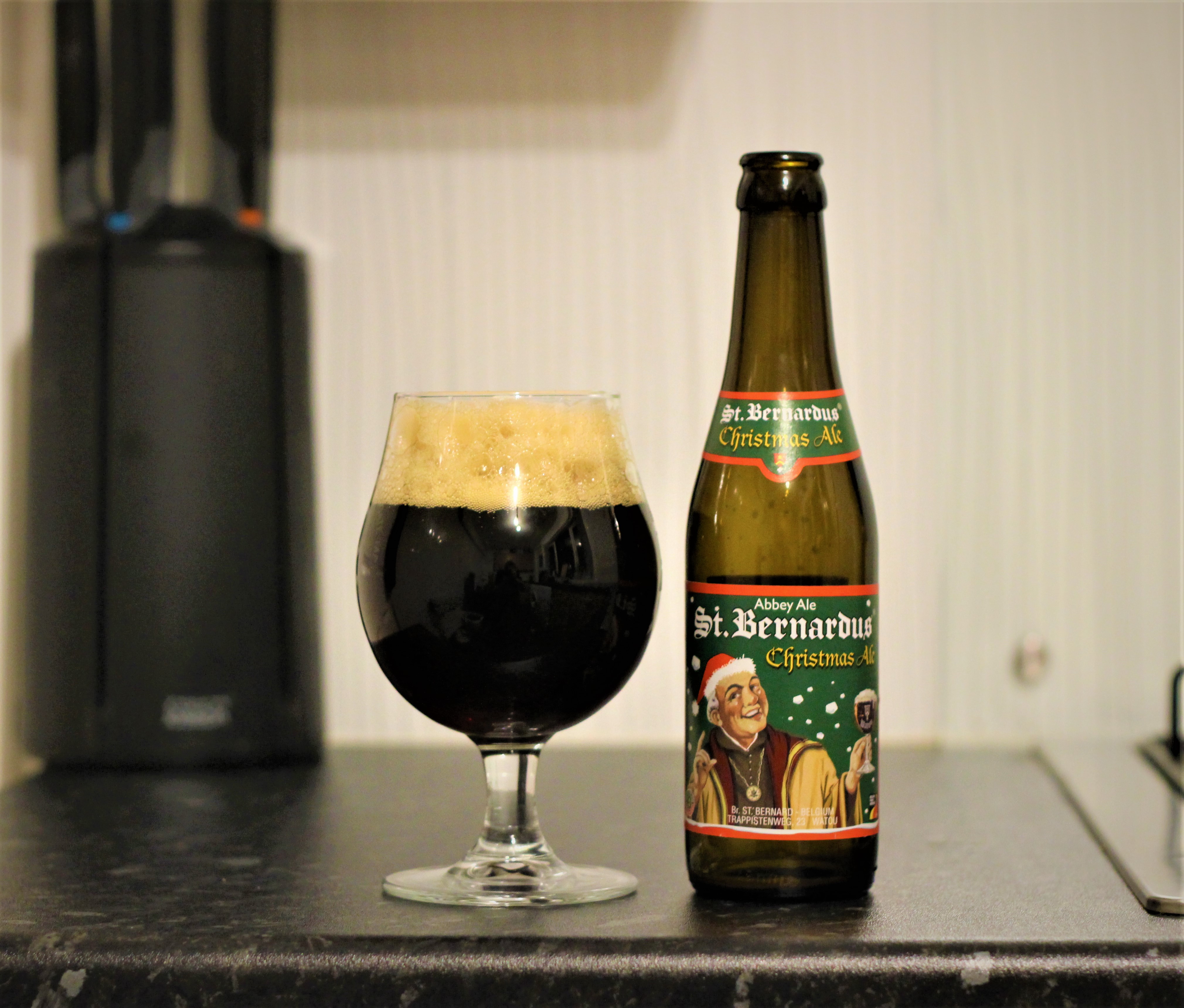 photo of st bernardus beer in a glass next to the bottle