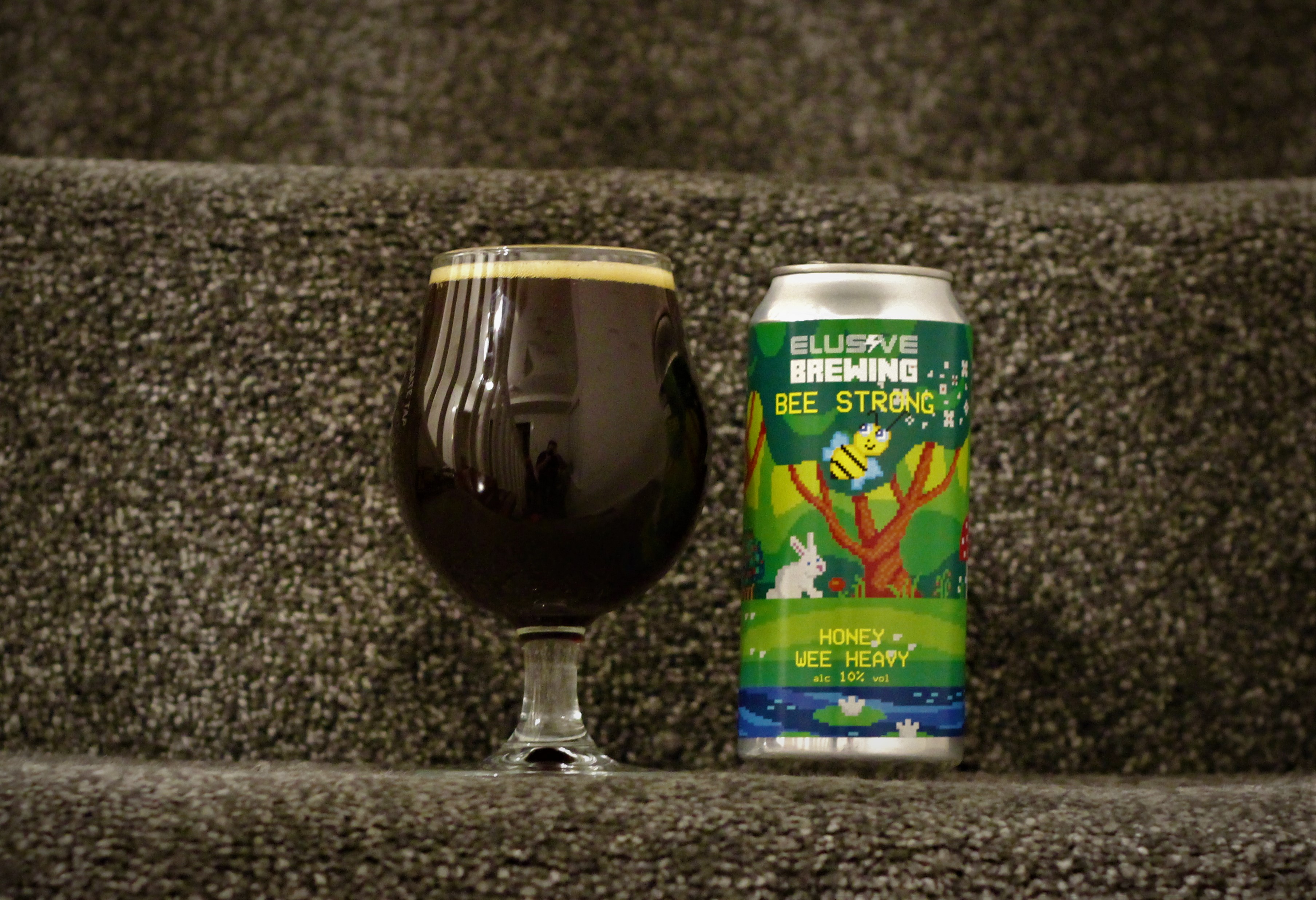 photo of elusive beer in glass next to can