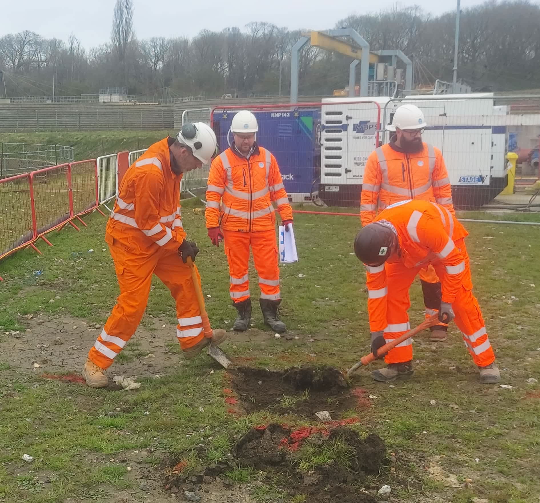 Delegates using locating equipment on site