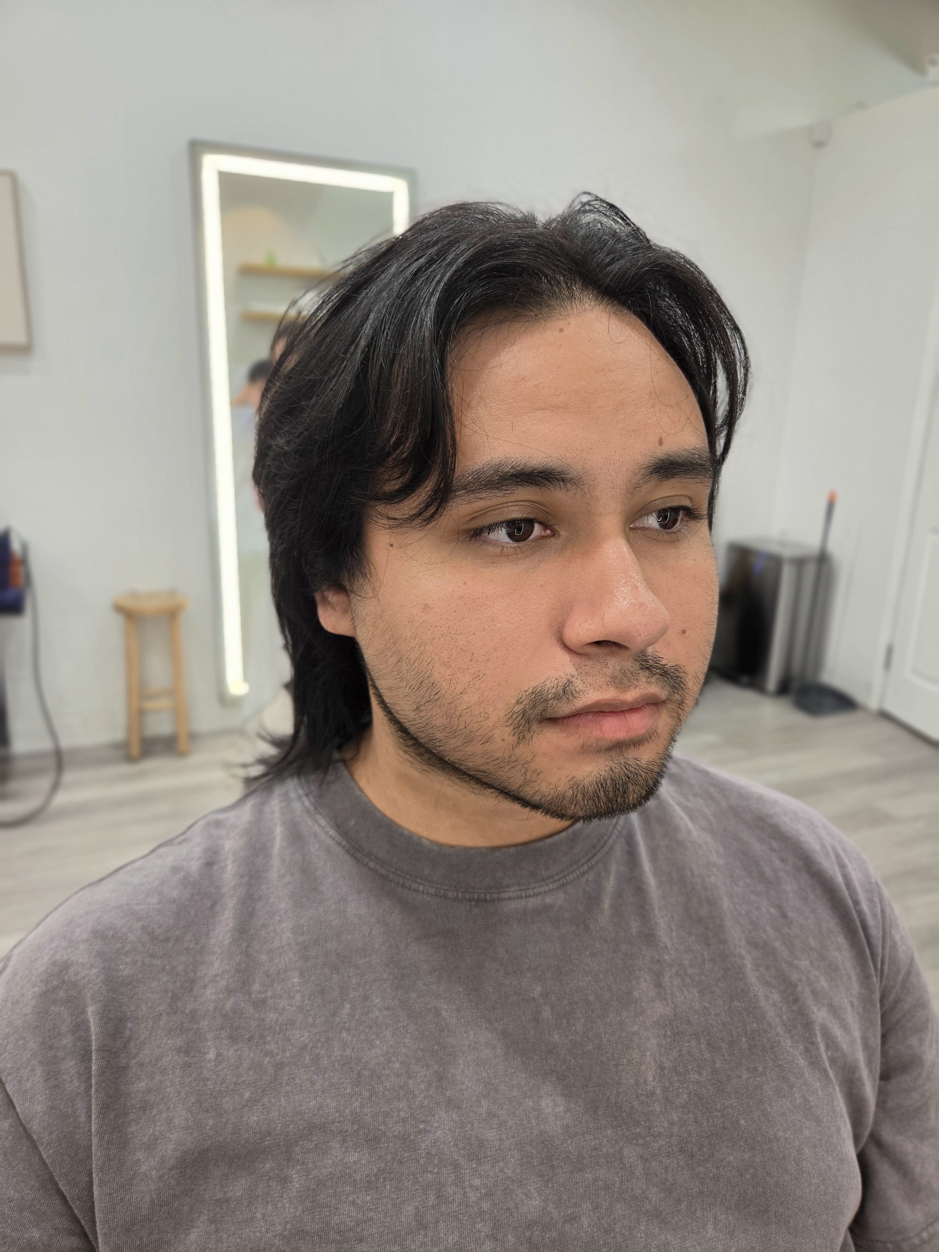 Center-parted longer hairstyle with curved front sections and length through the nape at B SIDE U Pasadena.