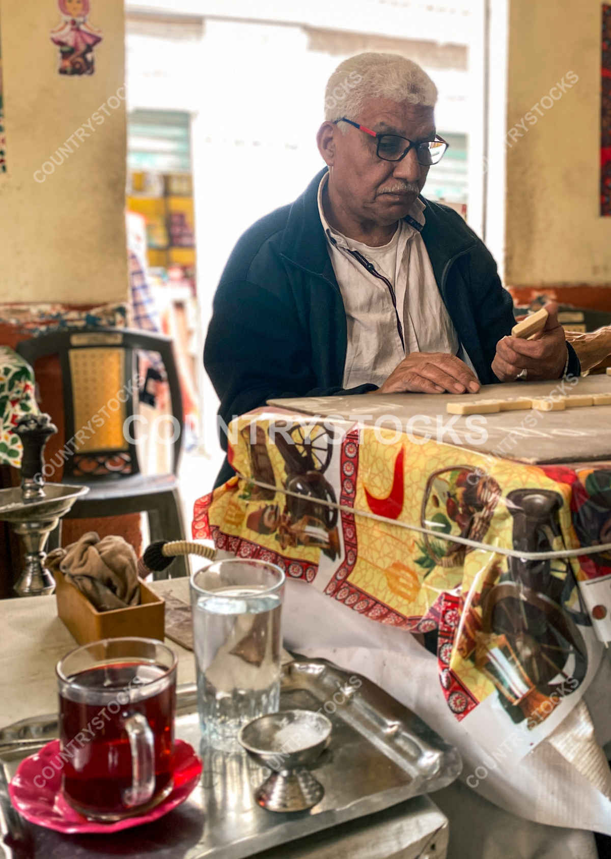 Egyptian elder in traditional ahwa cafe