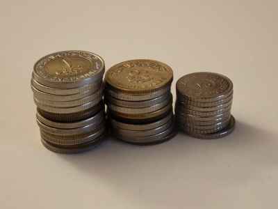 Egyptian Pound Coins Stacked in Growing Piles