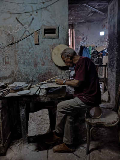 Egyptian Drum Maker Crafting a Traditional Tabla Frame