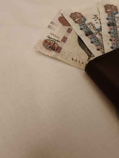 Egyptian Pound Banknotes in Black Leather Wallet
