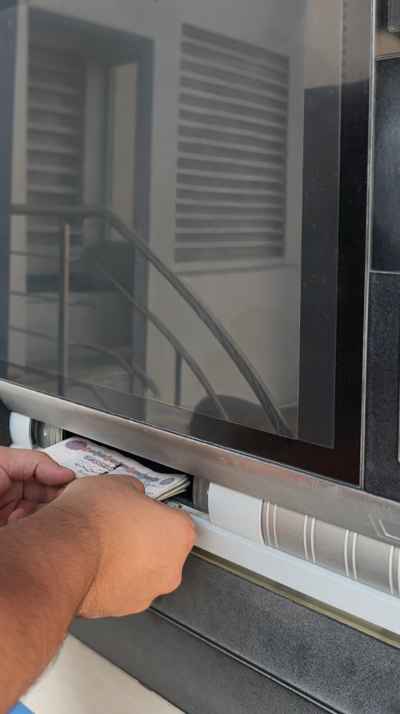 Cash Deposit Into ATM Machine Slot