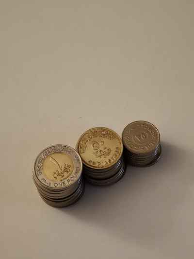 Egyptian Pound and Piastre Coin Stacks