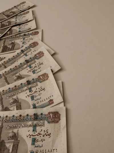 Egyptian 100 Pound Banknotes Fanned on Surface