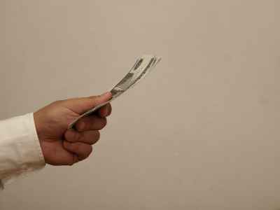 Hand Holding Egyptian 100 Pound Banknotes