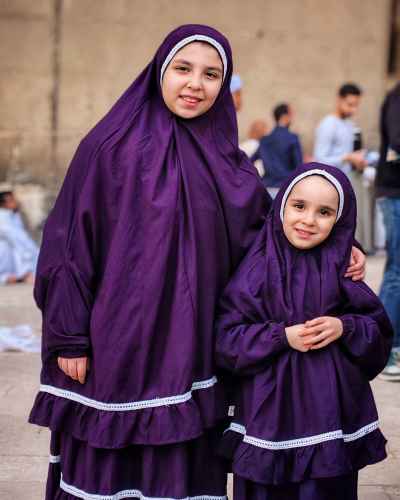 Two Girls in Elegant Eid Prayer Outfits at Sultan Hassan Mosque