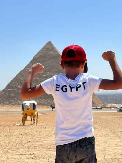 Boy Flexing at Giza Pyramids, Egypt