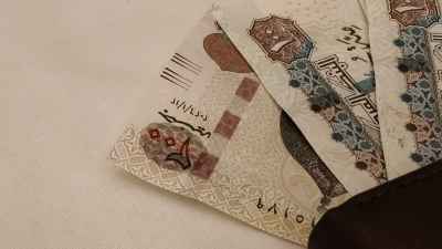 Egyptian Pound Banknotes on White Surface