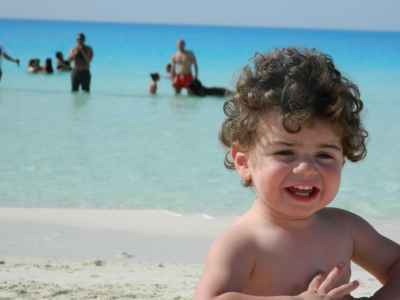 Toddler Smiling on North Coast Beach, Marsa Matruh