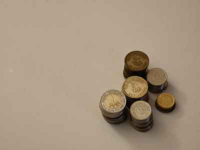 Egyptian Pound Coins Stacked on White Surface